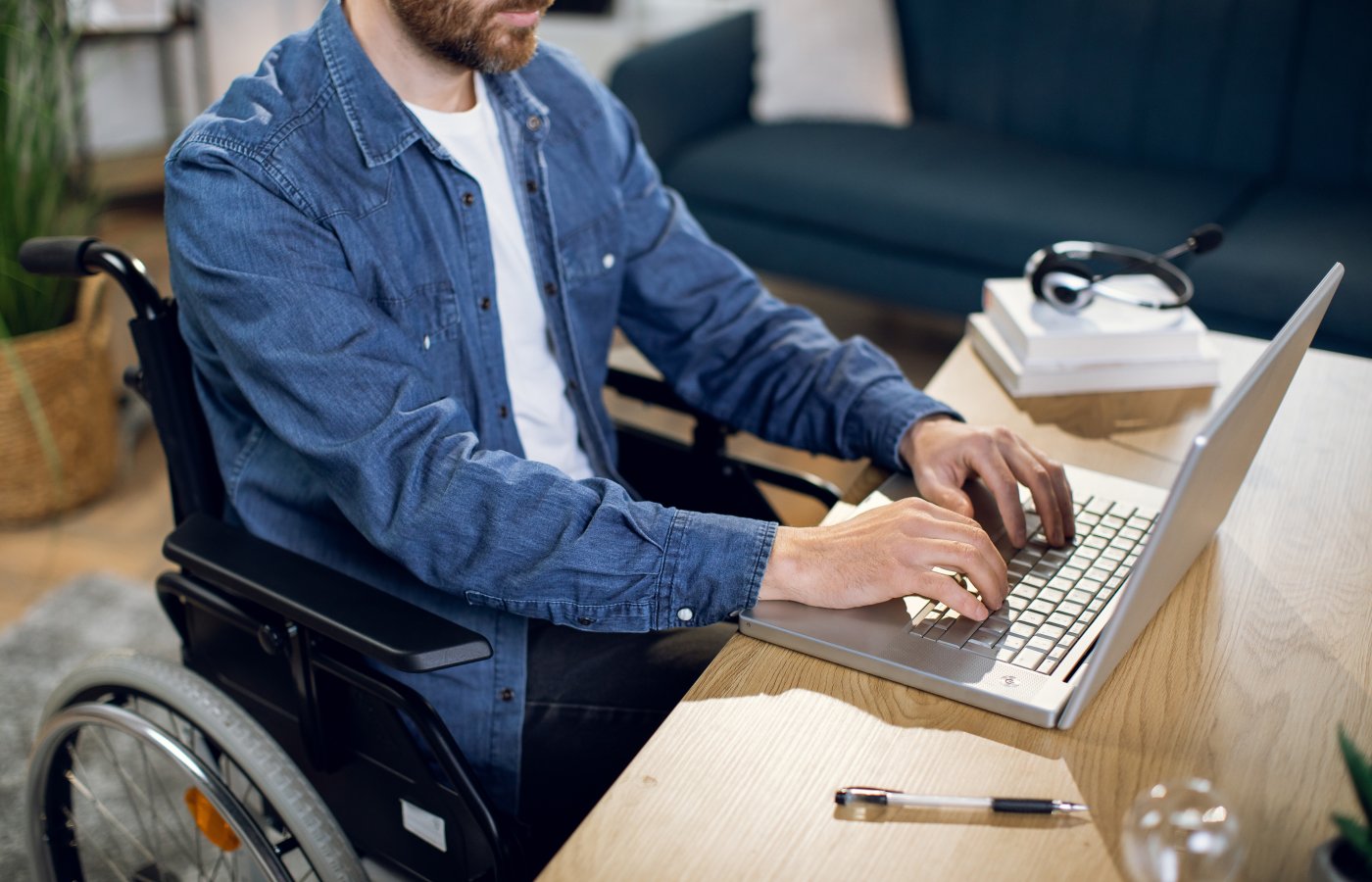 Person in wheelchair working on computer 