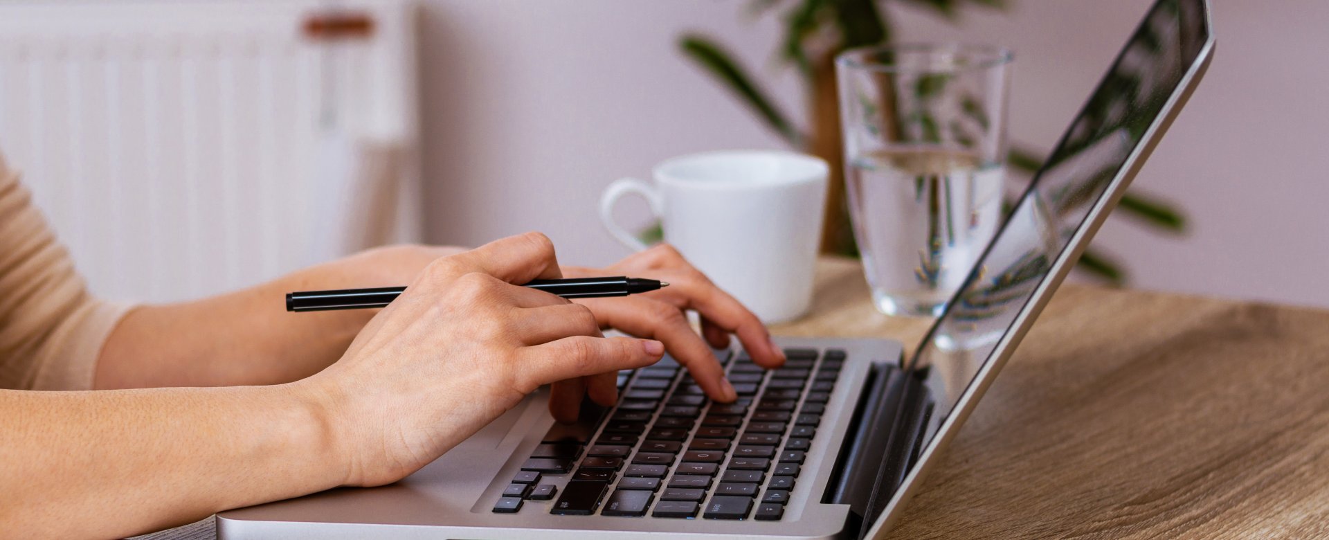 person typing on laptop 