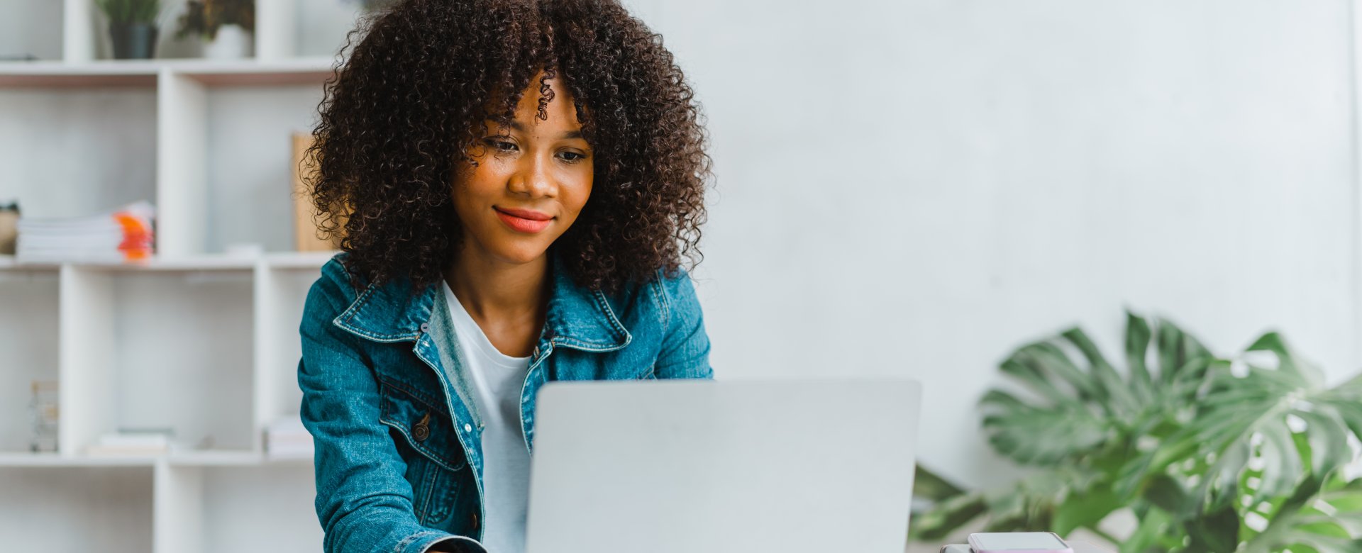 woman on laptop smiling